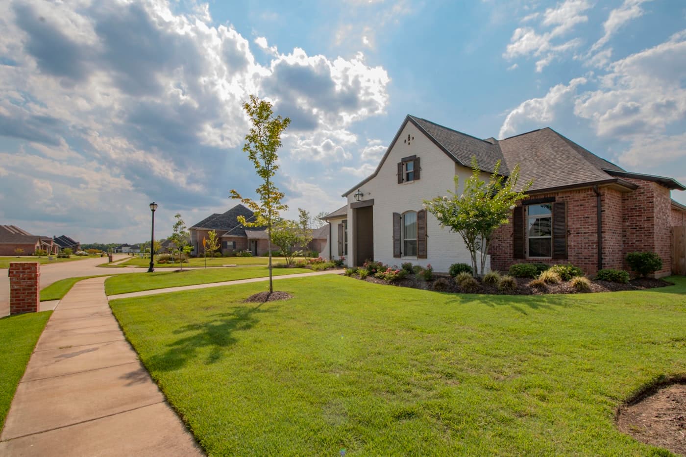 A suburban home with a freshly mowed lawn and clean edges